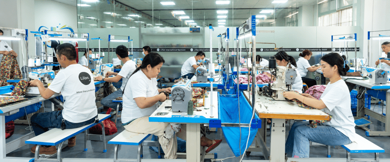 Garment workers sewing womenswear at the Lilian Apparel factory.